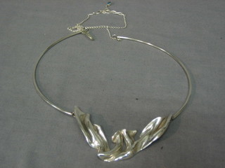 A silver necklet together with a silver pendant