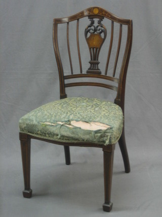 An Edwardian inlaid mahogany bedroom chair, raised on square tapering supports ending in spade feet