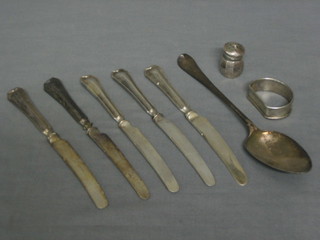 A Georgian silver Old English pattern table spoon, a silver napkin ring, 5 silver bladed tea knives and a Sterling pepperette