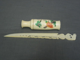 A miniature carved ivory vase 4" and a carved ivory paper knife decorated a bridge of elephants 8"