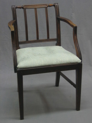 A mahogany stick and rail back open arm carver chair