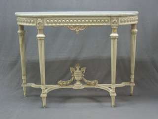 A 19th/20th Century white painted D shaped console table with white veined marble top, raised on turned and fluted supports, the stretcher decorated a lidded urn 51"