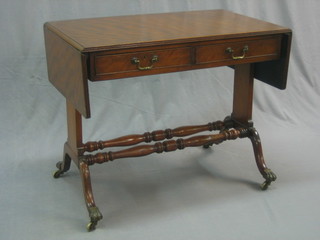 A Georgian style mahogany sofa table fitted 2 drawers and raised on standard end supports (old break to leg) 35"