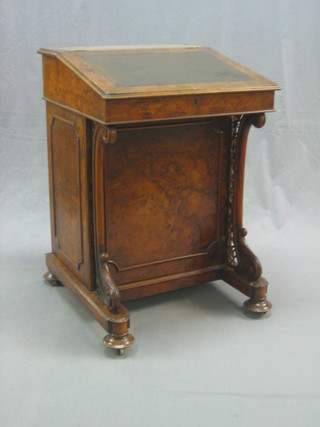 A Victorian walnut Davenport with hinged lid, the pedestal fitted 4 drawers enclosed by a panelled door 22"