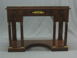 A handsome French Empire mahogany side table with ormolu mounts, fitted 1 long drawer flanked by 2 short drawers, raised on turned columns and with shaped base 45"