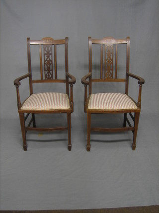 A pair of Edwardian inlaid mahogany open arm chairs
