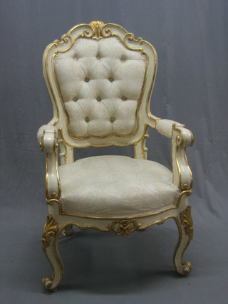 A handsome 19th Century French open arm salon chair upholstered in white buttoned back material, raised on cabriole supports