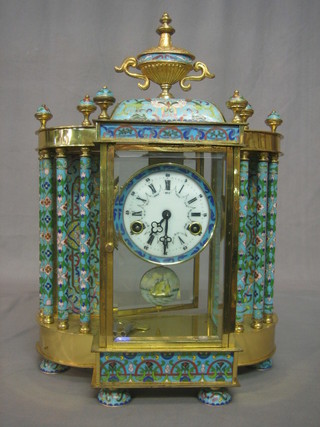 A gilt metal and champ leve enamelled gilt 4 glass striking mantel clock, surmounted by a lidded urn