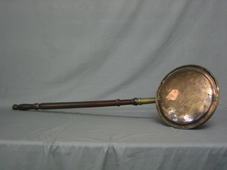 An 18th/19th Century copper warming pan with turned fruit wood handle