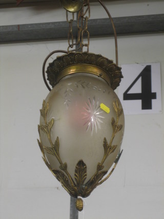 A gilt metal and glass oval shaped light fitting