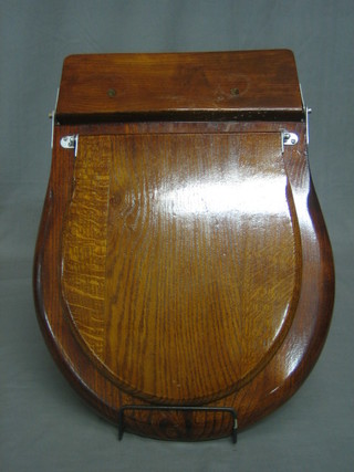 An old hardwood lavatory seat