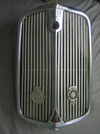 A Rover 75 chrome radiator gill with RAC full members badge and AA Commercial Vehicle badge
