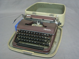 An Olympus portable typewriter the lid with presentation plaque to Major General C Lloyd CB CBE TD, City & Guilds of London Institute