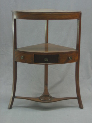A 19th Century mahogany corner wash stand, fitted a drawer, raised on splayed and outstretched supports 23"