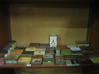 A large collection of various cigarette tins etc