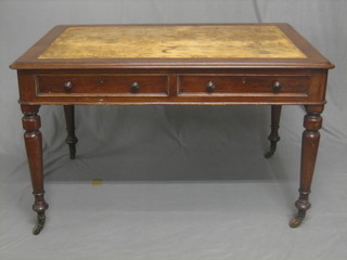 A Victorian mahogany library/writing table fitted 2 drawers and raised on turned supports 47"