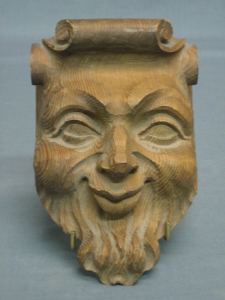 A carved lime wood bracket in the form of The Green Man 6 1/2"