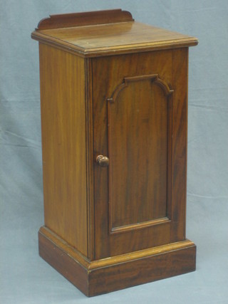 A 19th Century walnut pedestal pot cupboard enclosed by a panelled door 14"