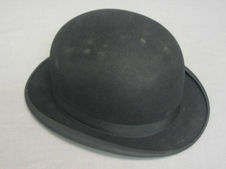 A gentleman's black and grey light weight bowler hat by Christie, complete with box