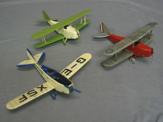 A Meccano style model of a Royal Air Force bi-plane 11", 1 other in green 11" and a pressed metal model of a twin seat aircraft marked G-EXSF