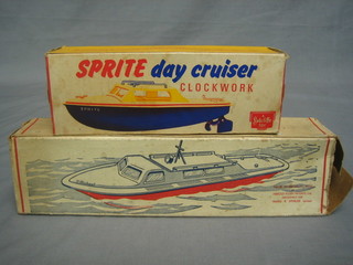 A Harold electric model boat together with an Sutcliffe clockwork day boat