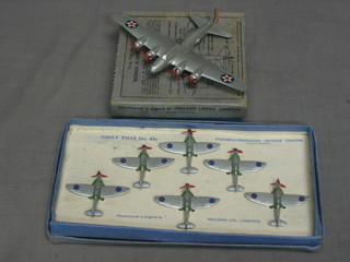 A Dinky model of a Boeing Flying Fortress no. 62G, boxed together with 6 Dinky models of Supermarine Spitfires no. 62E