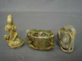 A carved Eastern figure of a stylised turtle 6" and 2 circular  Eastern carved hardstone jars and covers