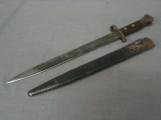 A Wilkinson's double edged bayonet complete with scabbard