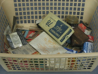 A plastic carton containing a collection of various gramophone needles etc