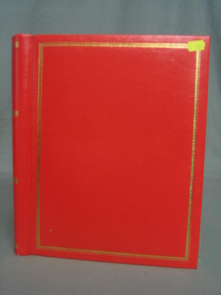 A red album containing various greetings cards, scraps etc
