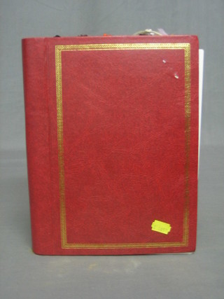 A red album containing a collection of various book marks