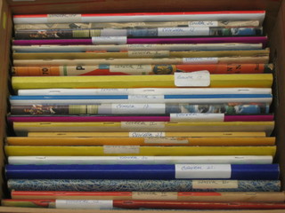 A cardboard box containing 23 various scrap albums