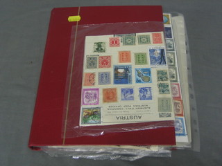 A red album of various World stamps
