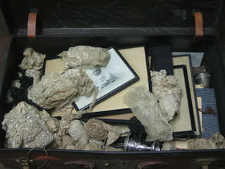 A suitcase containing a collection of various black and white portrait photographs, other ephemera and lace trim etc