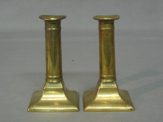 A pair of 19th Century brass candlesticks with ejectors 6"