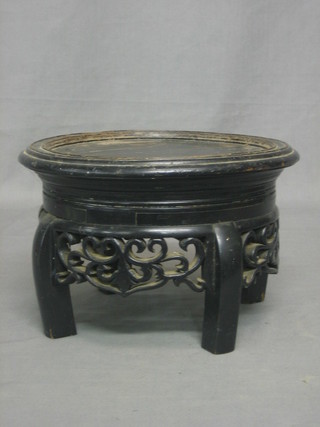 A circular Eastern wooden jardiniere or urn stand 10"
