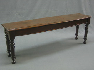 A 19th Century rectangular mahogany hall bench raised on turned supports 48" (missing arms) 