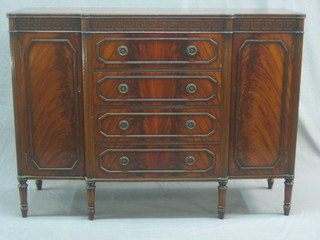 A Chippendale style mahogany break front sideboard with Grecian Key decoration fitted 4 drawers flanked by a pair of cupboards raised on turned supports 48"