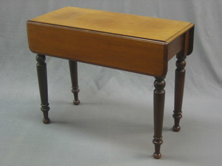 A Victorian bleached mahogany Pembroke table fitted a drawer and raised on turned supports 35"
