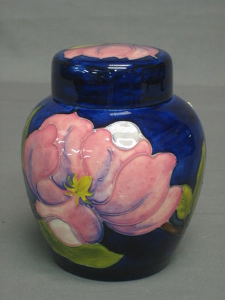 A Moorcroft Clematis Magnolia pattern ginger jar and cover, the base with signature mark and impressed Moorcroft England 6 1/2"