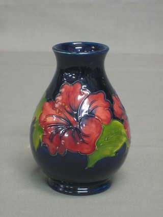 A  modern Moorcroft Hibiscus pattern  club shaped vase, the base impressed Moorcroft and incised AW 5 1/2" 