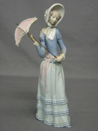 A Lladro figure of a standing lady with parasol 13"