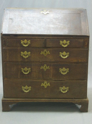 An 18th Century oak bureau with well and stepped fitted interior, above 2 short and 2 long drawers with brass swan neck drop handles, raised on bracket feet 34"