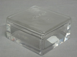 A Lalique square glass dressing table jar, the lid decorated the mask of a dog 4" (chip to lid)