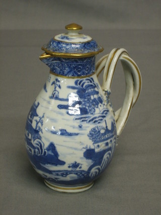 An 18th Century Oriental blue and white jug with strapwork handle and cover, decorated stylised Willow pattern 5"
