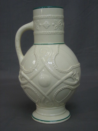 A Victorian white glazed pottery jug with serpent decoration 14"