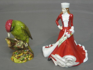 A Royal Doulton figure - The Wood Pecker 7" together with 1 other - Christmas Lady 2007 9"