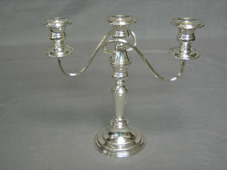 A silver plated 3 light candelabrum with bead work border 