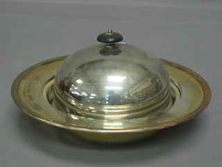 A circular silver plated muffin dish and cover