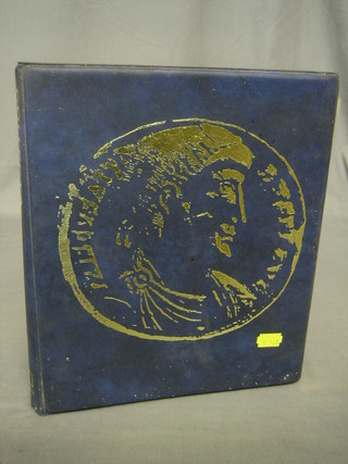 A plastic album containing various silver thruppences and other coins etc